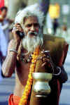kumbh-sadhu_with_mobile_phone-AFP.jpg (29182 bytes)
